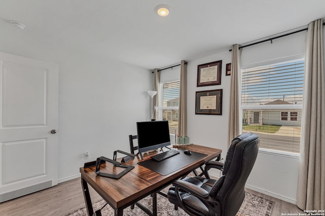 home office featuring light hardwood / wood-style flooring