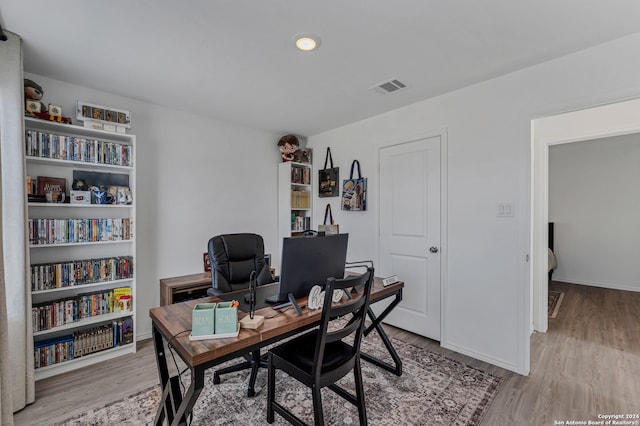 office space with light wood-type flooring