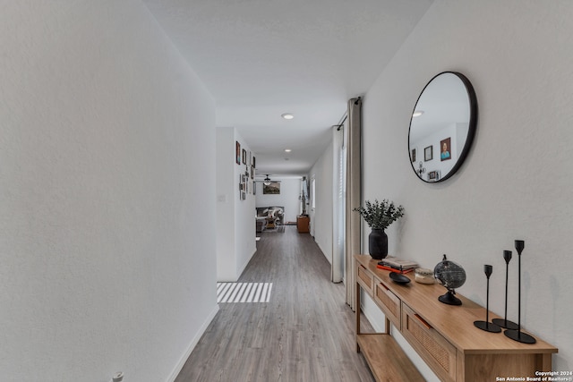 hall with light wood-type flooring