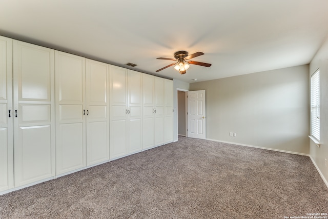 unfurnished bedroom featuring carpet flooring and ceiling fan