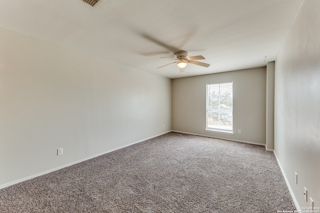 unfurnished room with carpet floors and ceiling fan