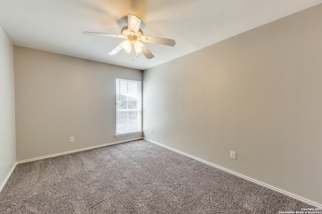 empty room featuring carpet flooring and ceiling fan