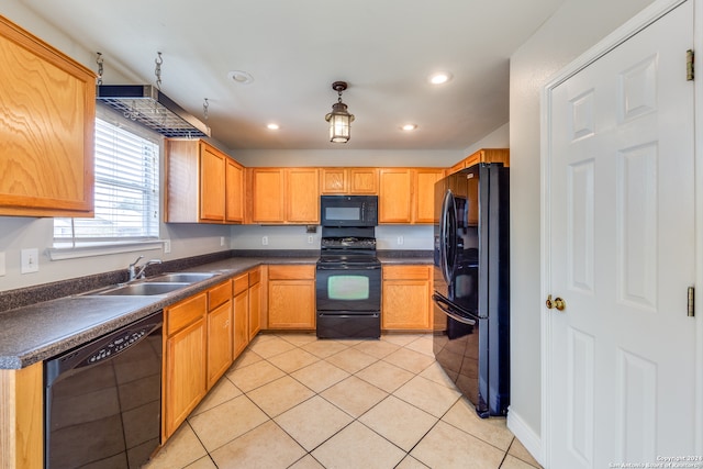 kitchen with sink, black appliances, and light tile patterned floors