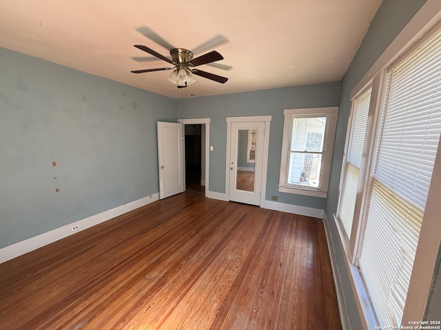 unfurnished bedroom featuring wood-type flooring and ceiling fan