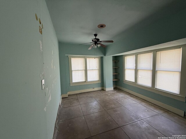 140 Jeffrey, San Antonio, TX 78201 - unfurnished room with a ceiling fan, baseboards, plenty of natural light, and tile patterned flooring