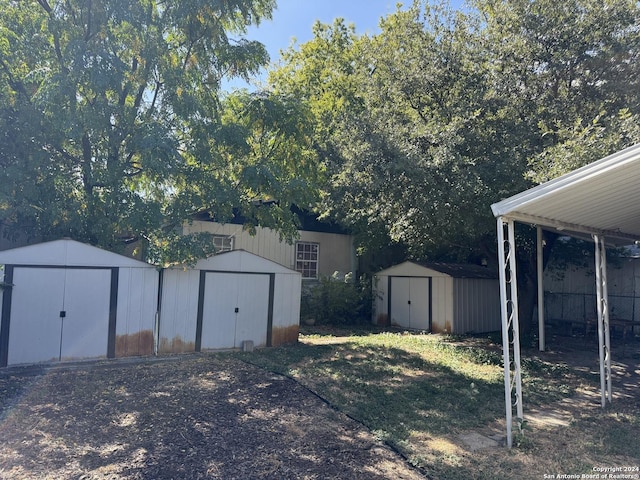 140 Jeffrey, San Antonio, TX 78201 - view of yard with a storage unit, fence, and an outbuilding