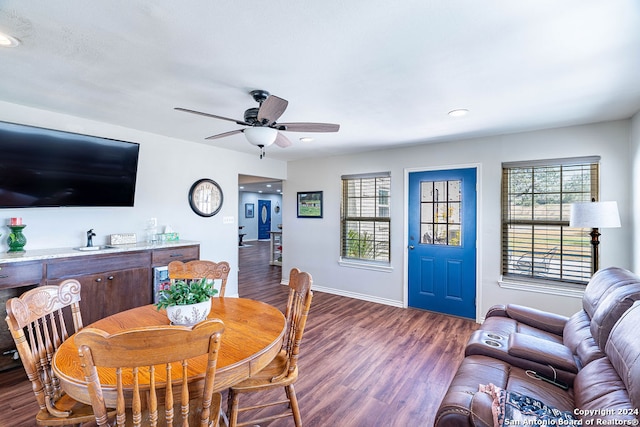 dining room featuring dark wood-type flooring and ceiling fan