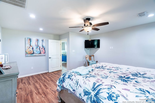 bedroom featuring ceiling fan and dark hardwood / wood-style floors