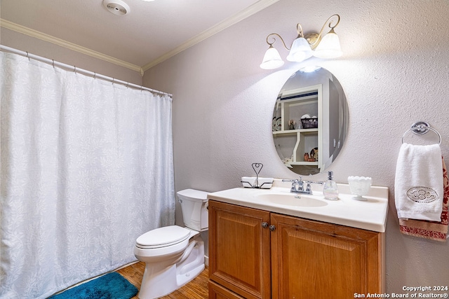 bathroom with vanity, crown molding, hardwood / wood-style flooring, and toilet