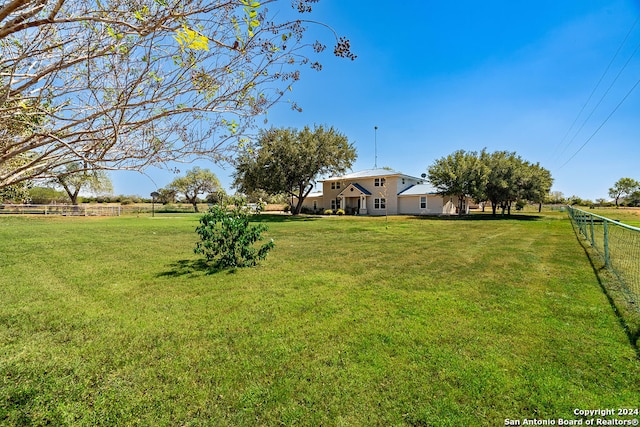 view of yard with a rural view