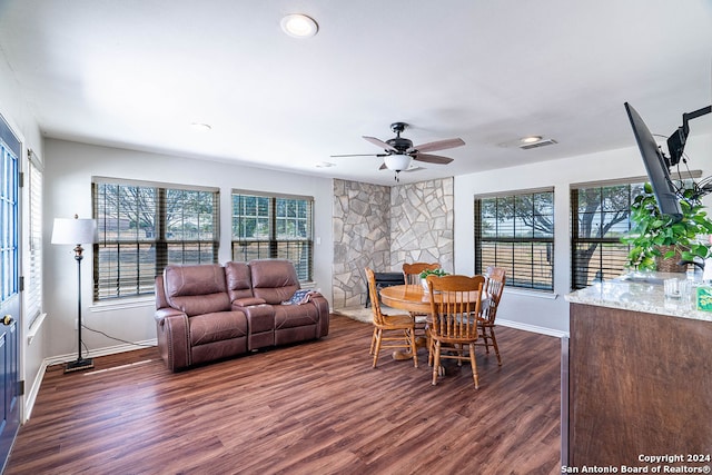 dining room with ceiling fan and dark hardwood / wood-style floors