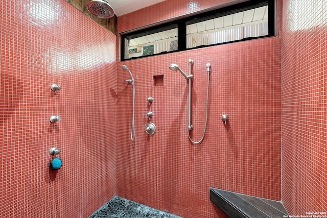 bathroom with tiled shower