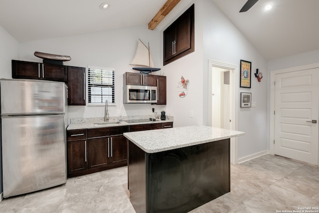 kitchen featuring stainless steel appliances, dark brown cabinets, sink, and a kitchen island