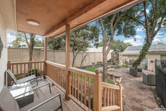 wooden terrace featuring a patio