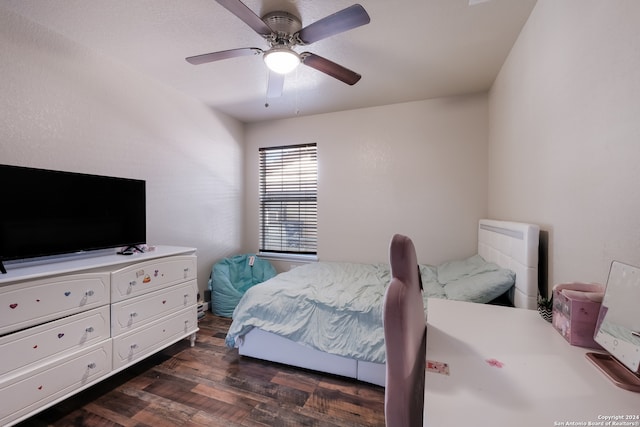 bedroom with ceiling fan and dark hardwood / wood-style flooring