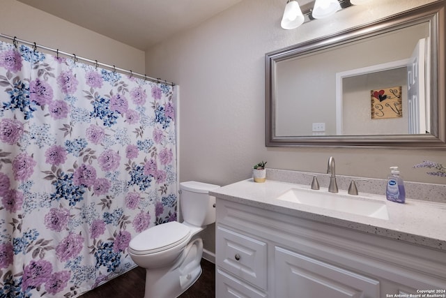 738 Kendalia Ave, San Antonio, TX 78221 - full bathroom with a shower with shower curtain, toilet, wood finished floors, and vanity