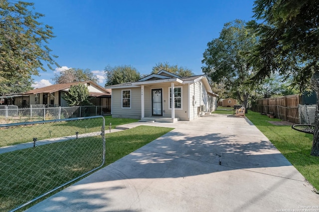 738 Kendalia Ave, San Antonio, TX 78221 - view of front of house featuring fence, a front yard, and concrete driveway