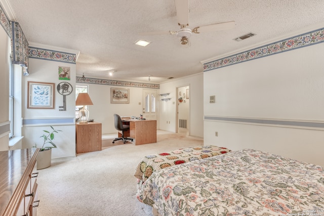 carpeted bedroom featuring ceiling fan, a textured ceiling, and ornamental molding