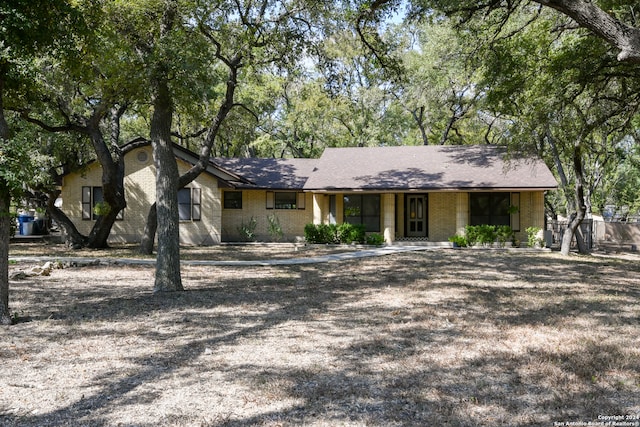 ranch-style home with covered porch