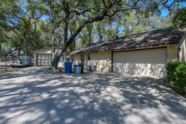 exterior space featuring an outbuilding and a garage