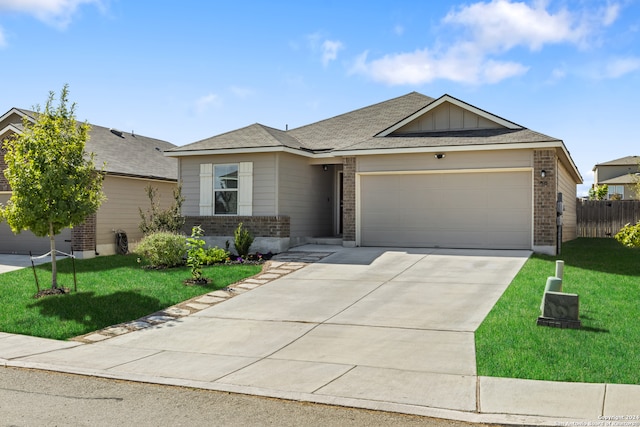 ranch-style home with a front yard and a garage