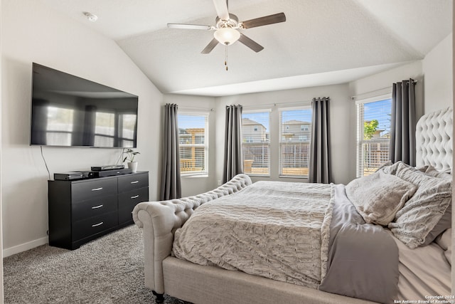 bedroom featuring ceiling fan, carpet flooring, lofted ceiling, and multiple windows