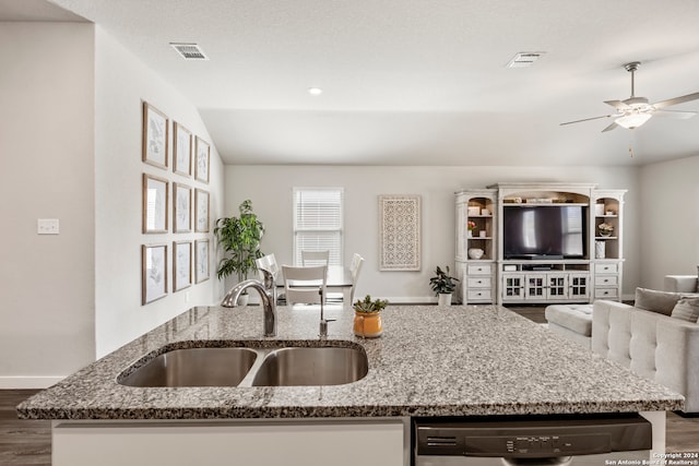 kitchen with ceiling fan, stainless steel dishwasher, dark hardwood / wood-style floors, stone countertops, and sink