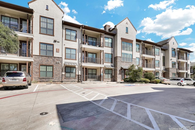 7342 Oak Manor Dr Unit 1204, San Antonio, TX 78229 - view of building exterior with uncovered parking