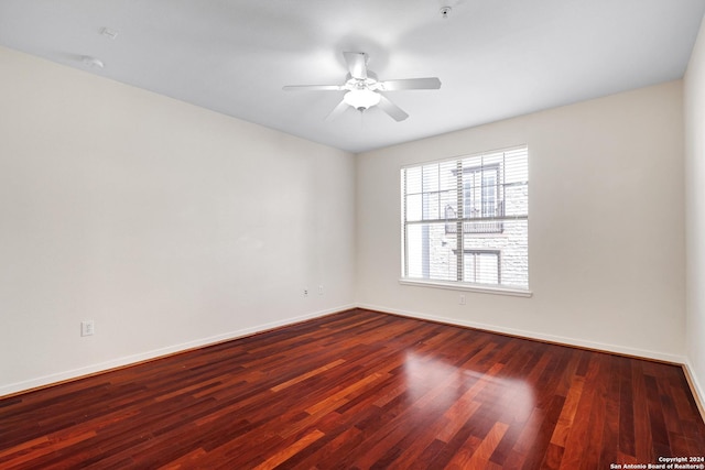 7342 Oak Manor Dr Unit 1204, San Antonio, TX 78229 - spare room featuring baseboards, wood finished floors, and ceiling fan