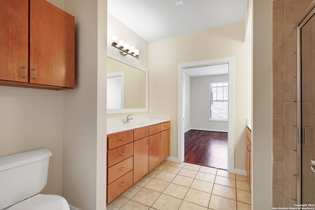 7342 Oak Manor Dr Unit 1204, San Antonio, TX 78229 - bathroom with vanity, toilet, tile patterned floors, tiled shower, and baseboards