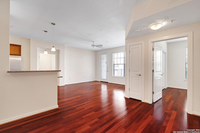 7342 Oak Manor Dr Unit 1204, San Antonio, TX 78229 - unfurnished living room with dark wood finished floors, a ceiling fan, and baseboards