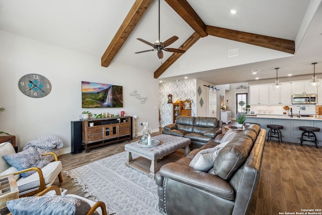 living room featuring ceiling fan, high vaulted ceiling, wood-type flooring, and beamed ceiling