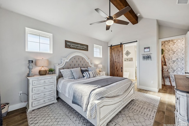 bedroom featuring a barn door, connected bathroom, light wood-type flooring, and ceiling fan