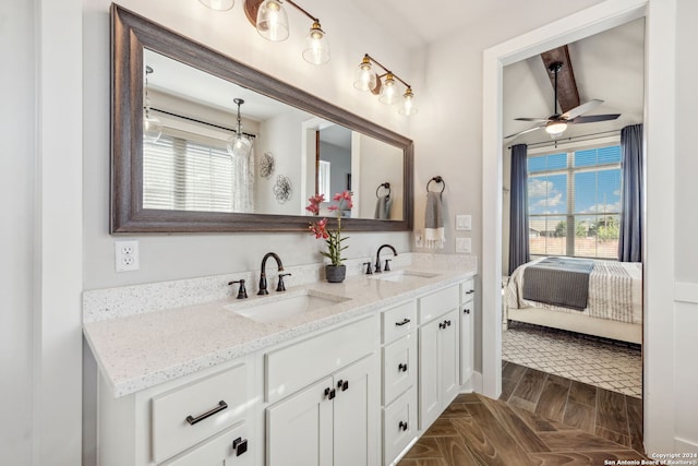 bathroom featuring vanity, ceiling fan, parquet floors, and plenty of natural light