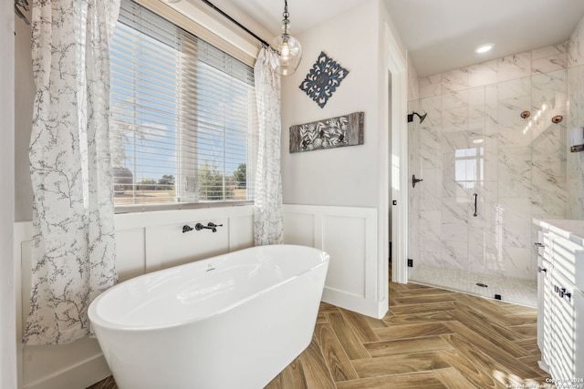 bathroom with vanity, shower with separate bathtub, and parquet floors