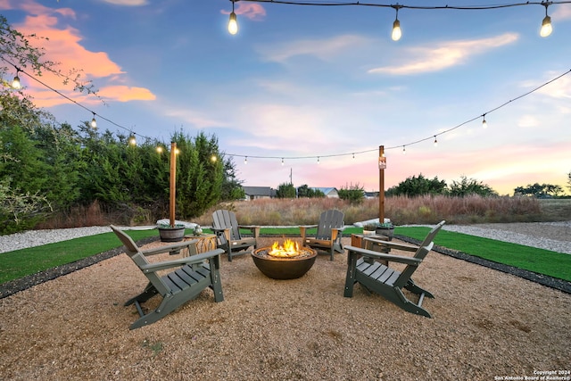 view of community with an outdoor fire pit