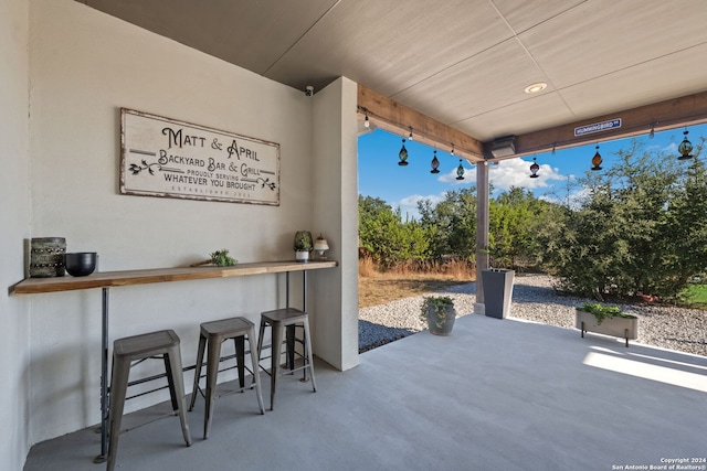 view of patio with a bar