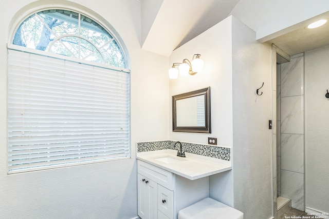 bathroom with vanity and vaulted ceiling