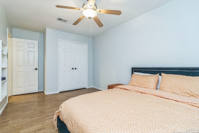 bedroom featuring a closet, ceiling fan, and wood-type flooring