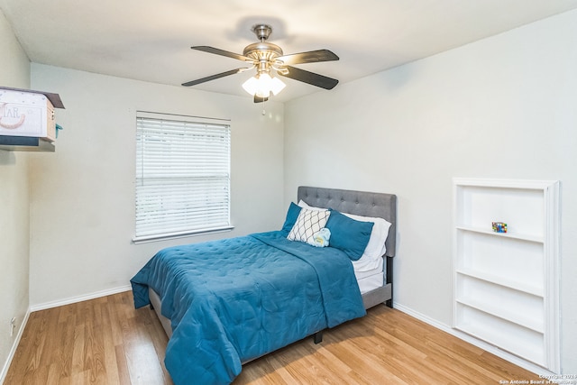 bedroom featuring wood-type flooring and ceiling fan