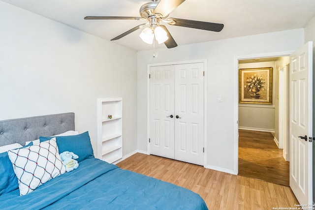 bedroom with a closet, ceiling fan, and light wood-type flooring