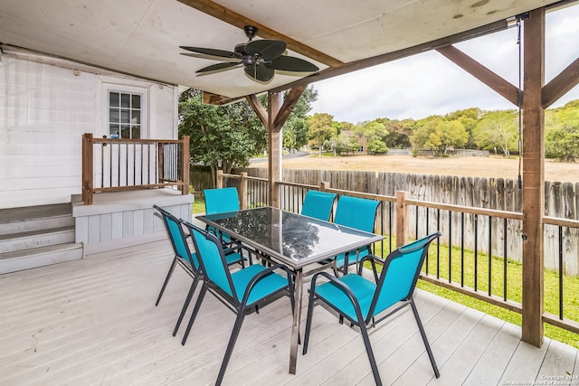 deck featuring a lawn and ceiling fan