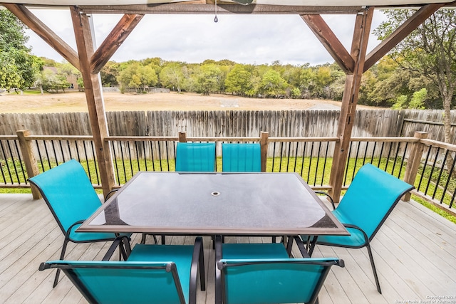 wooden deck with a yard