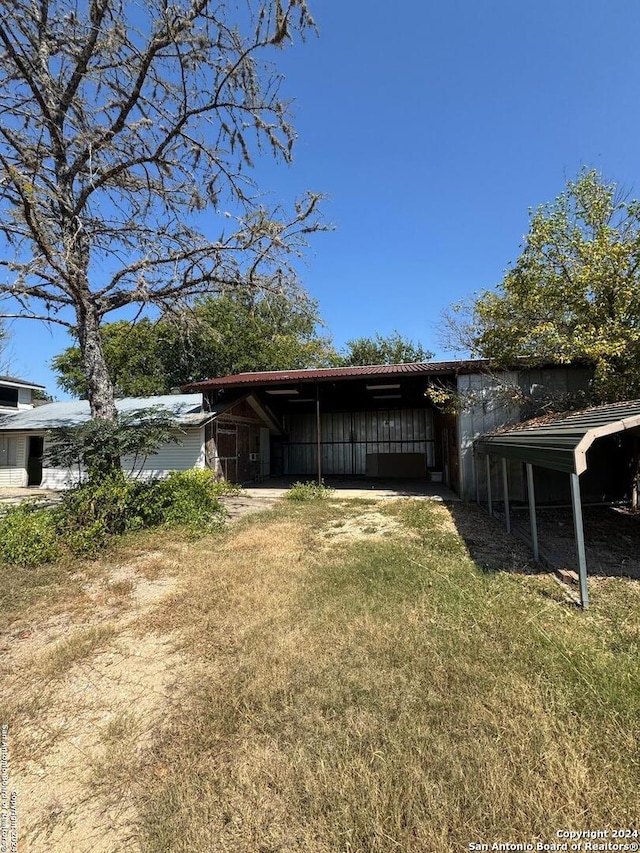 exterior space with a carport