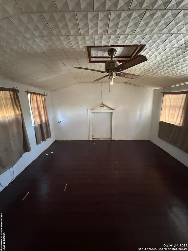 unfurnished room with hardwood / wood-style floors, a healthy amount of sunlight, and ceiling fan