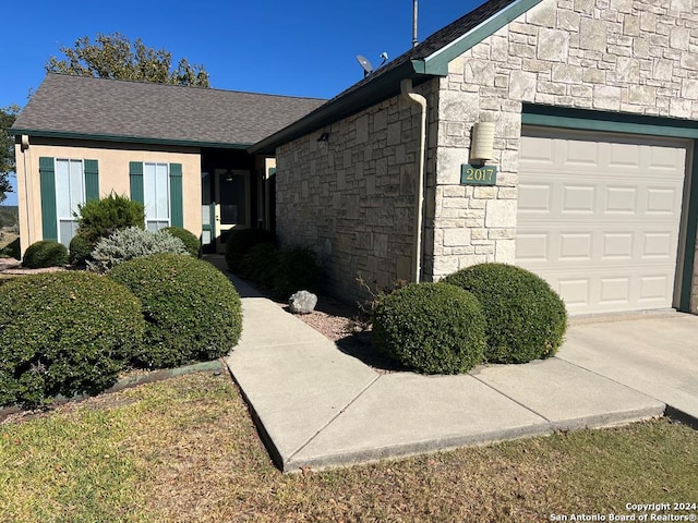 view of side of home with a garage