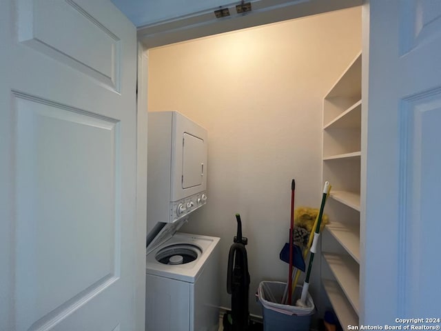 washroom featuring stacked washer and dryer