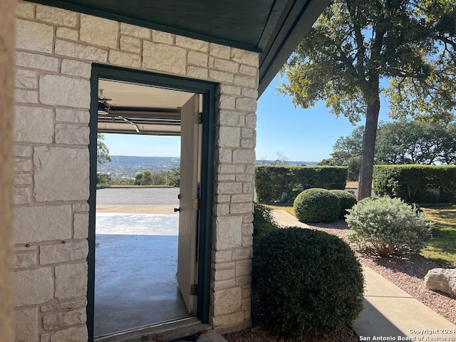 doorway to outside featuring concrete floors