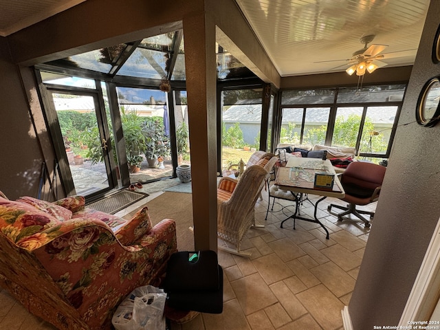 sunroom featuring ceiling fan