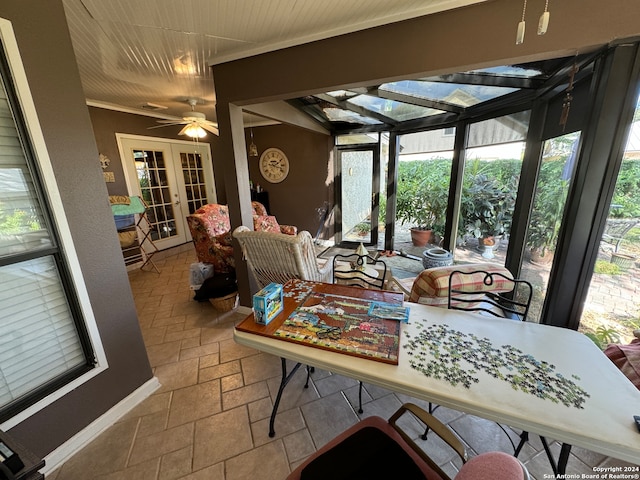 sunroom with french doors and ceiling fan